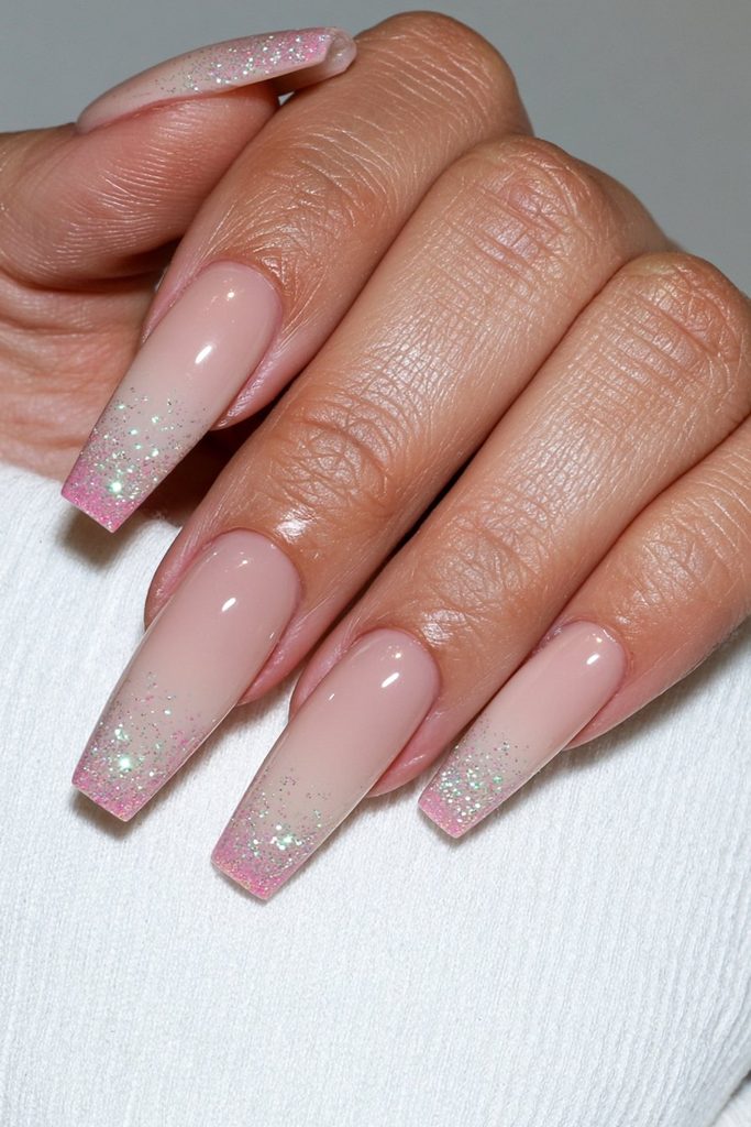 Coffin nails with sparkling glitter gradient concentrated toward tips