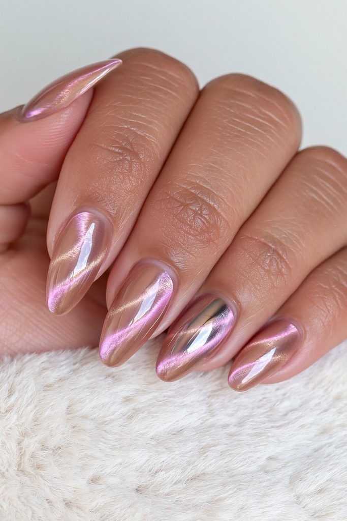 Gold cat-eye nails with reflective chrome accent details