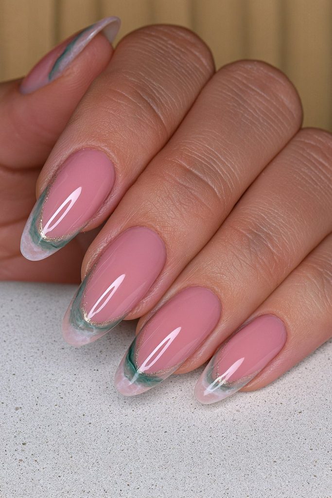 Green marble nails with elegant swirling natural stone patterns