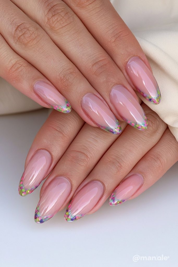 Green French tip nails decorated with playful polka dots
