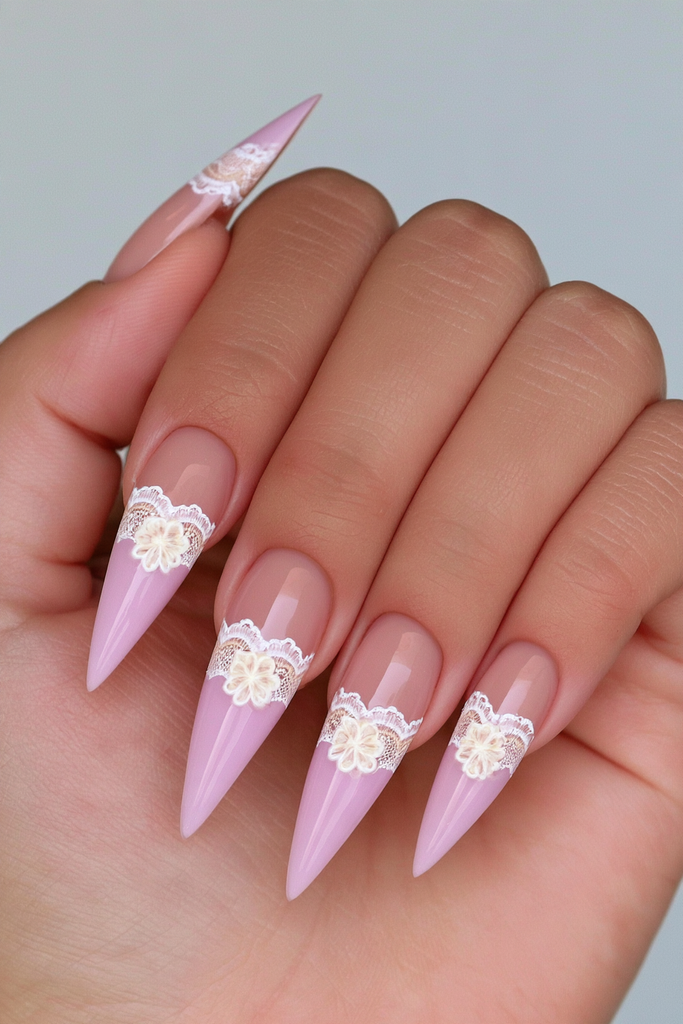 Stiletto nails with delicate hand-painted lace detailing