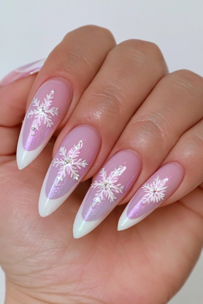 Icy blue and white nails featuring delicate frosty snowflakes