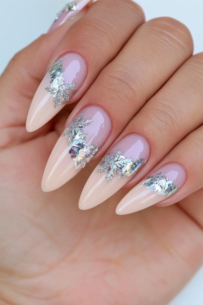 20 Glamorous Snowflake Nail Ideas to Sparkle Through Winter 10 Metallic foil snowflake nail wraps