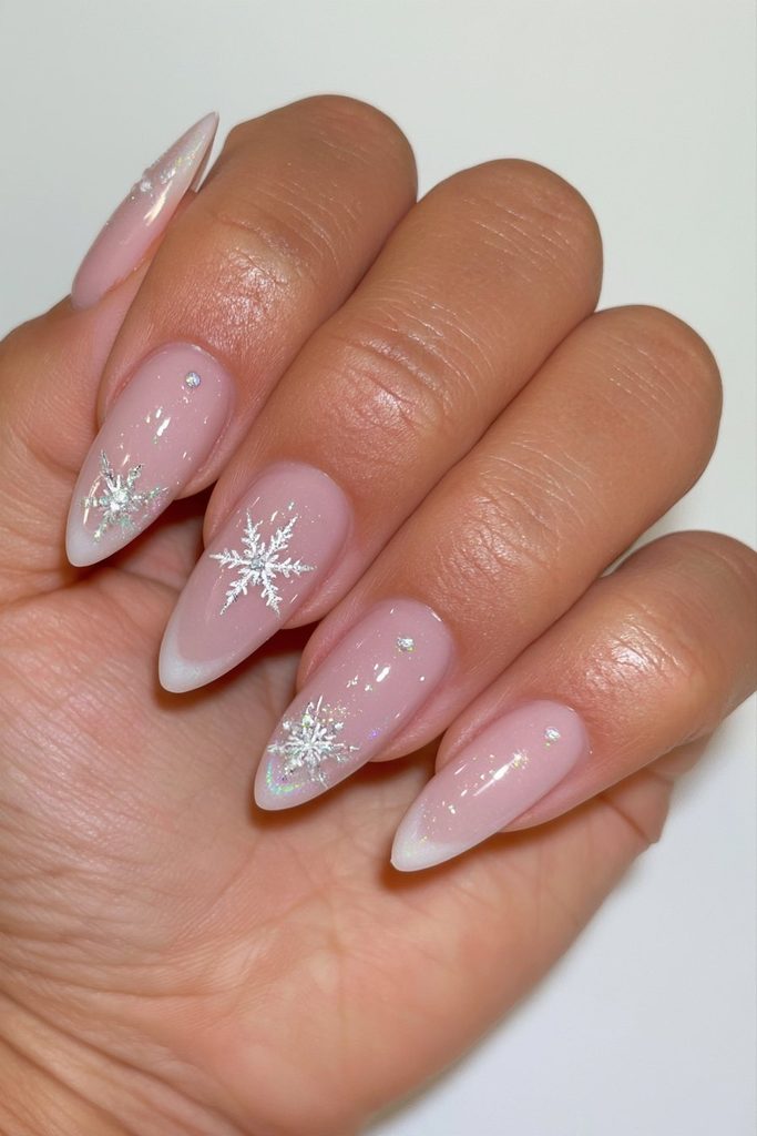 20 Glamorous Snowflake Nail Ideas to Sparkle Through Winter 19 Milky nude snowflake accent nails
