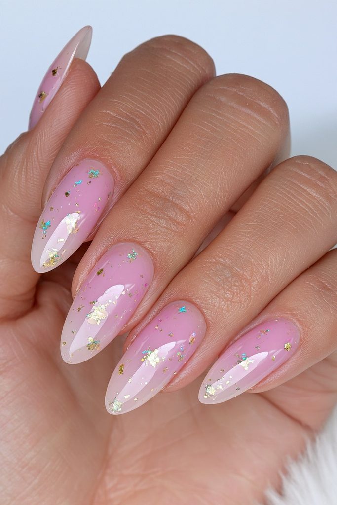 Milky nude nails with gold confetti