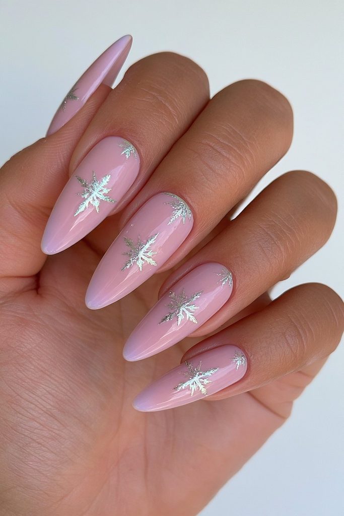 20 Glamorous Snowflake Nail Ideas to Sparkle Through Winter 7 Milky white nails with silver snowflakes