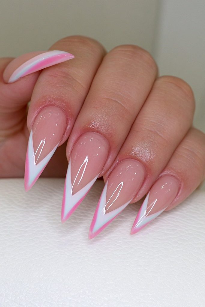 Negative space stiletto nails with modern French tip design
