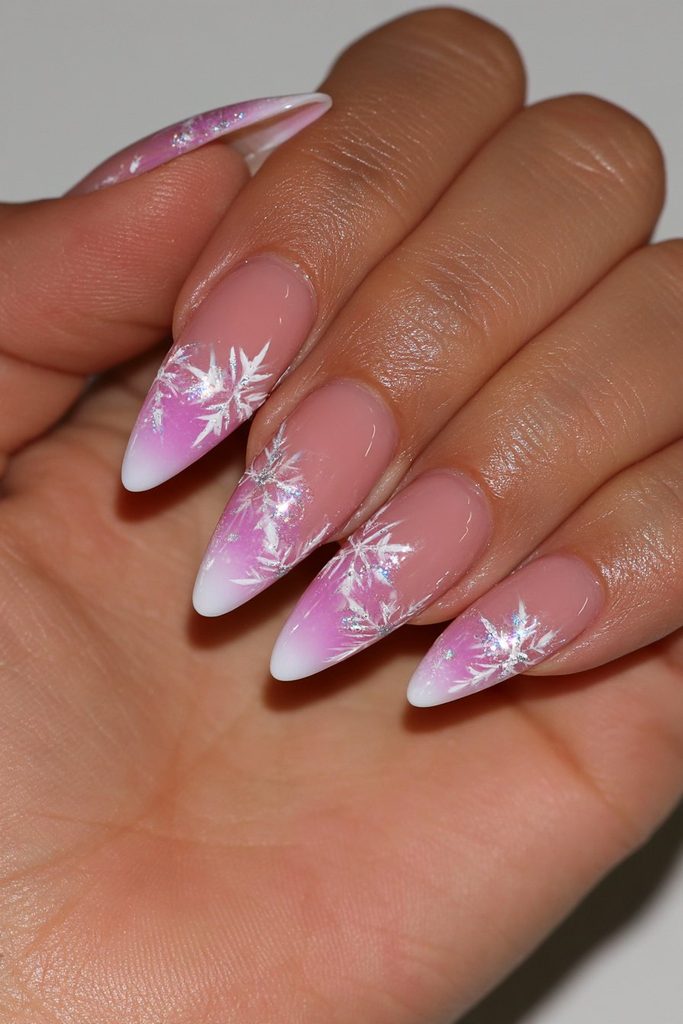 Ombre nails featuring delicate white snowflakes over soft blended tones
