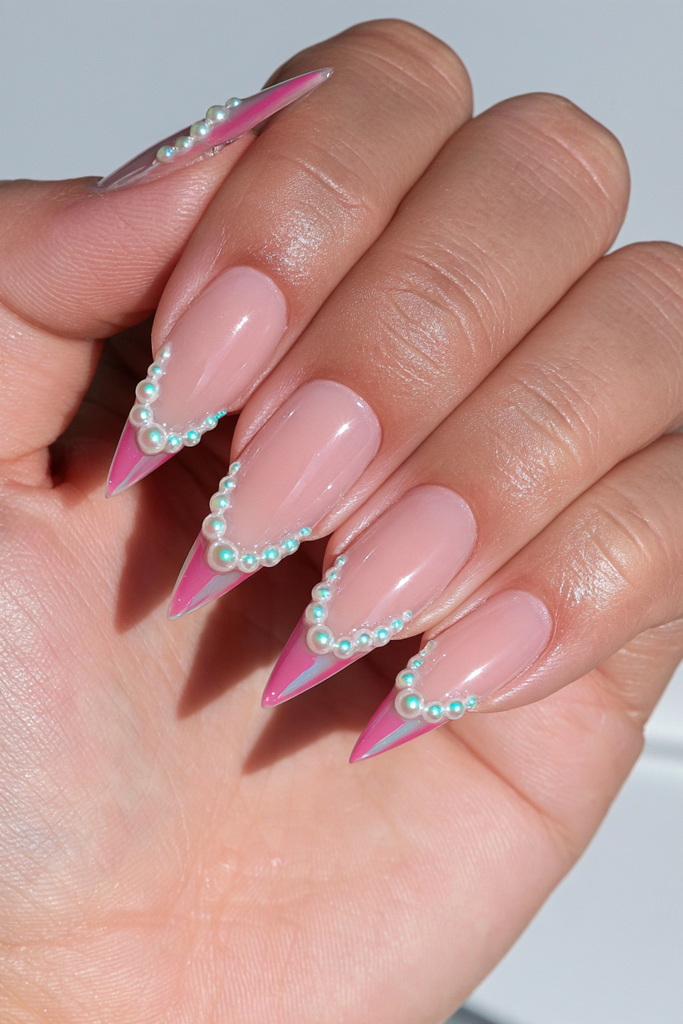 Stiletto nails with elegant pearl cuff embellishment details
