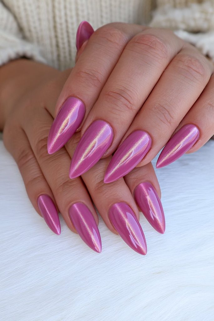 Ruby red jewel-tone cat-eye nails with glowing shimmer