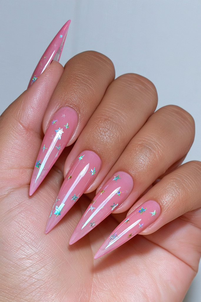 Stiletto nails decorated with sparkling scattered star confetti