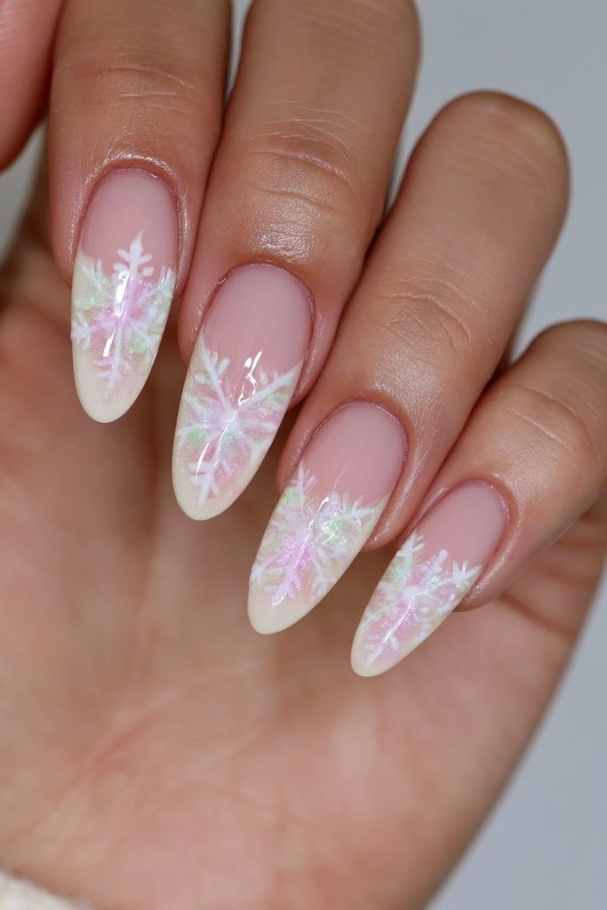 White-on-white nails with subtle layered snowflake designs and shine