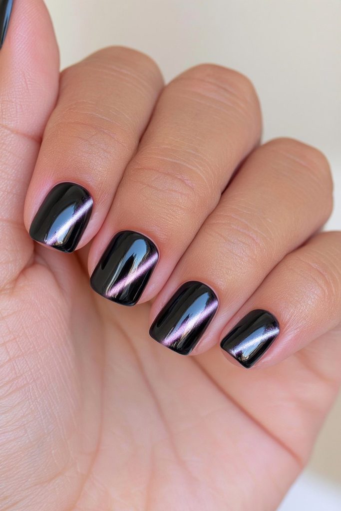 Short black cat-eye manicure nails