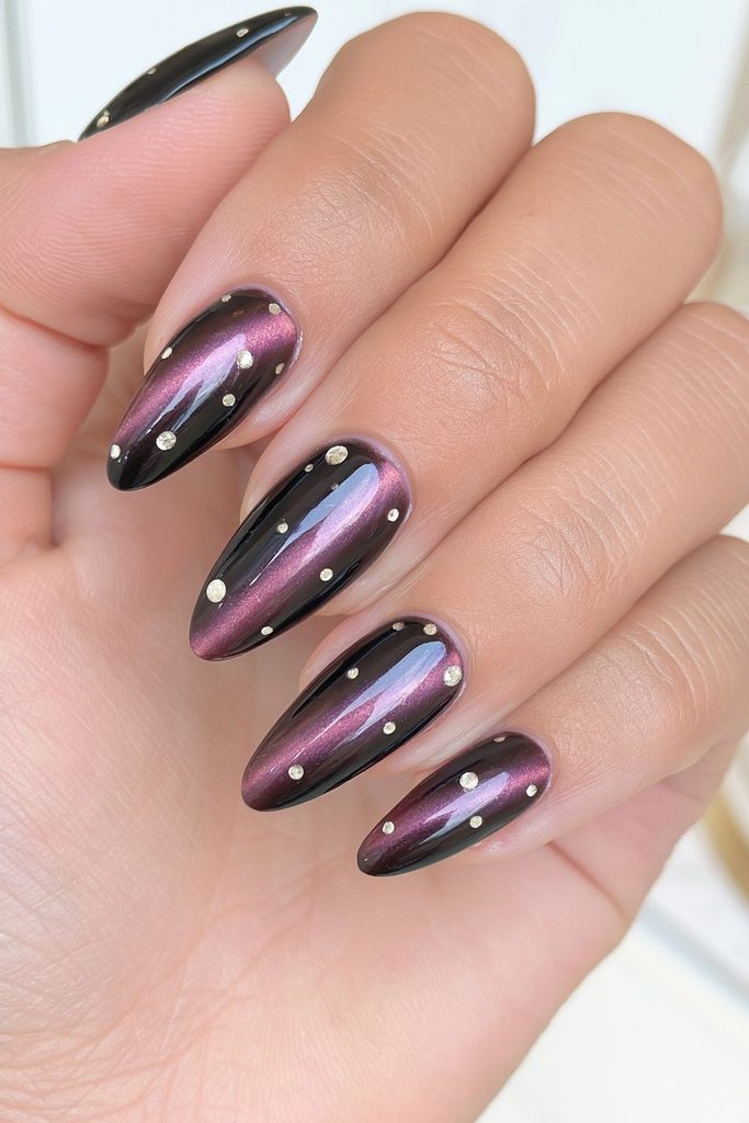 Black cat-eye polka dot nails