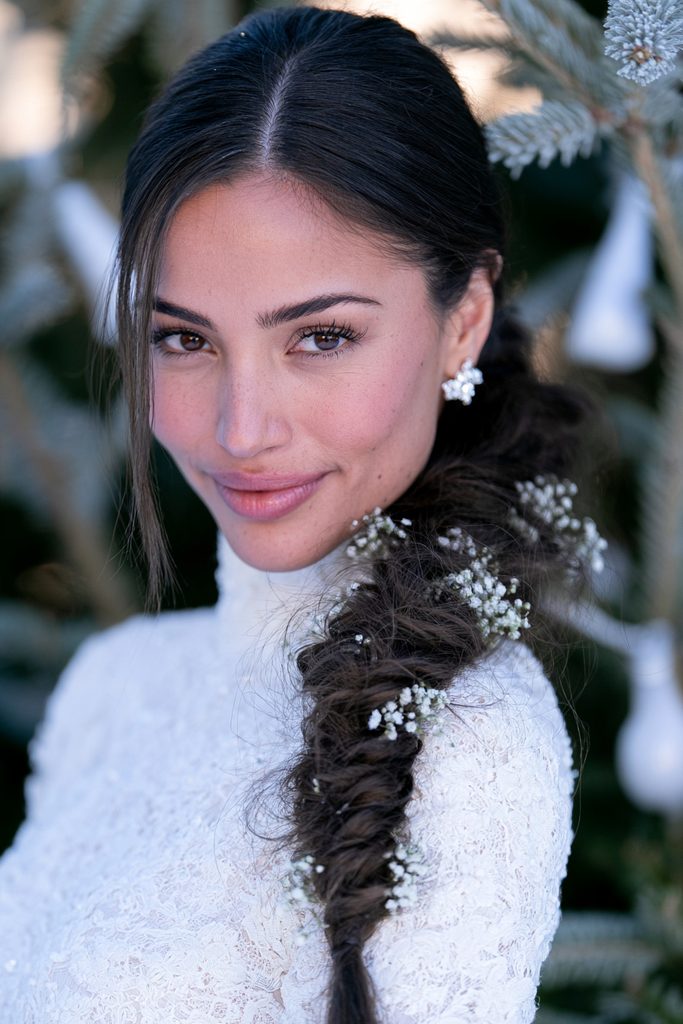 20 Christmas Wedding Hairstyles for Long Hair 6 Loose fishtail braid with white flowers
