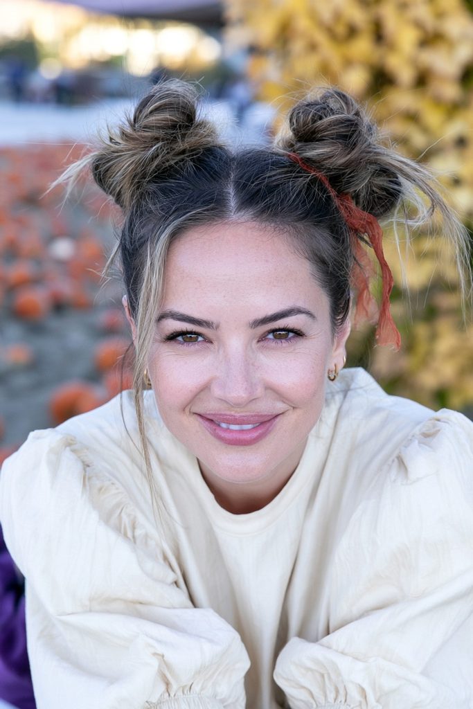22 Easy Pumpkin Patch Hairstyles That Feel Cozy 9 Whimsical double buns ribbon hairstyle